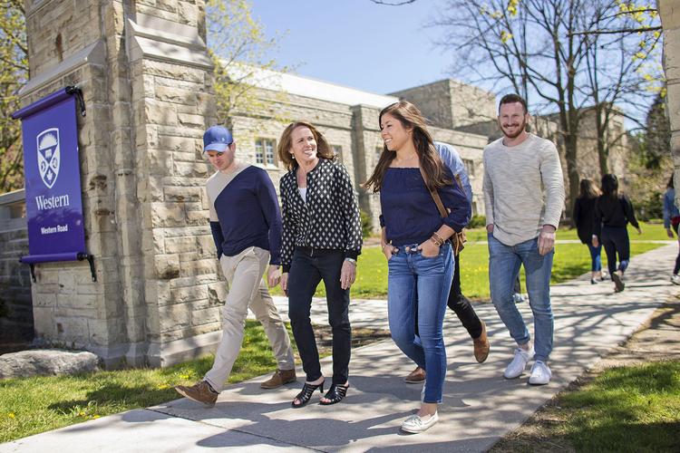 A group of students walking around campus